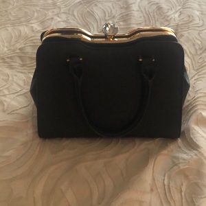 Cute purse. Black with chunky diamond clasp